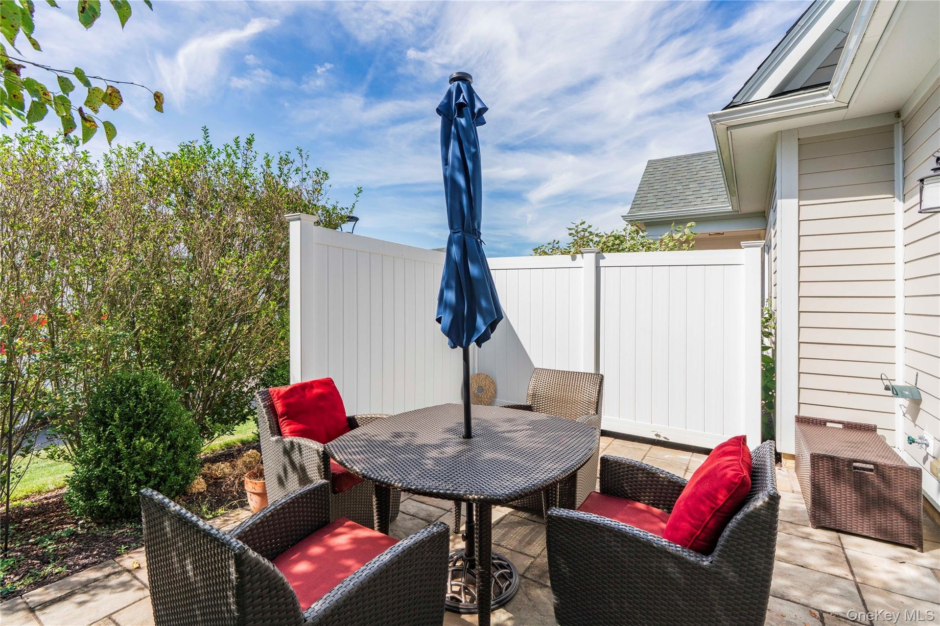 Sunny Private Patio Area with Stone Pavers