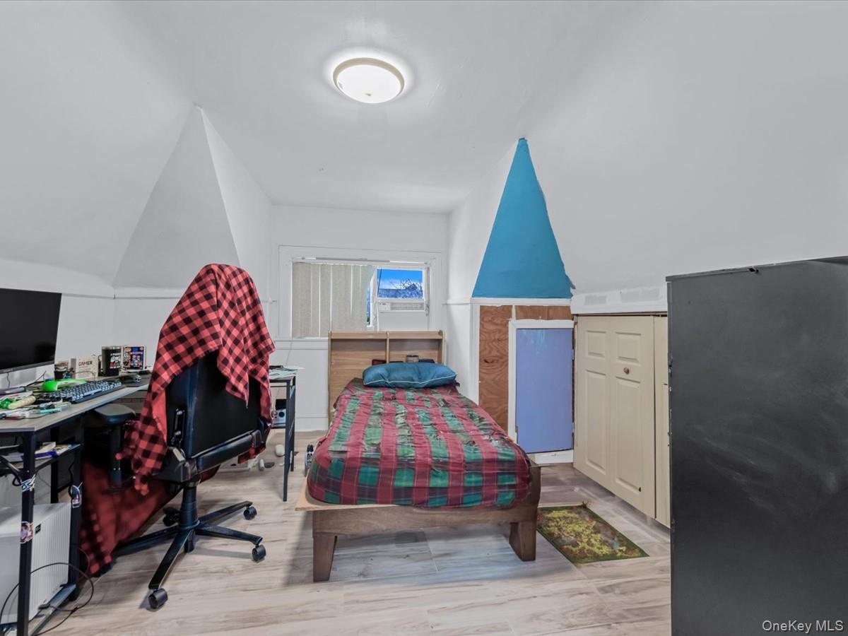 Bedroom featuring lofted ceiling