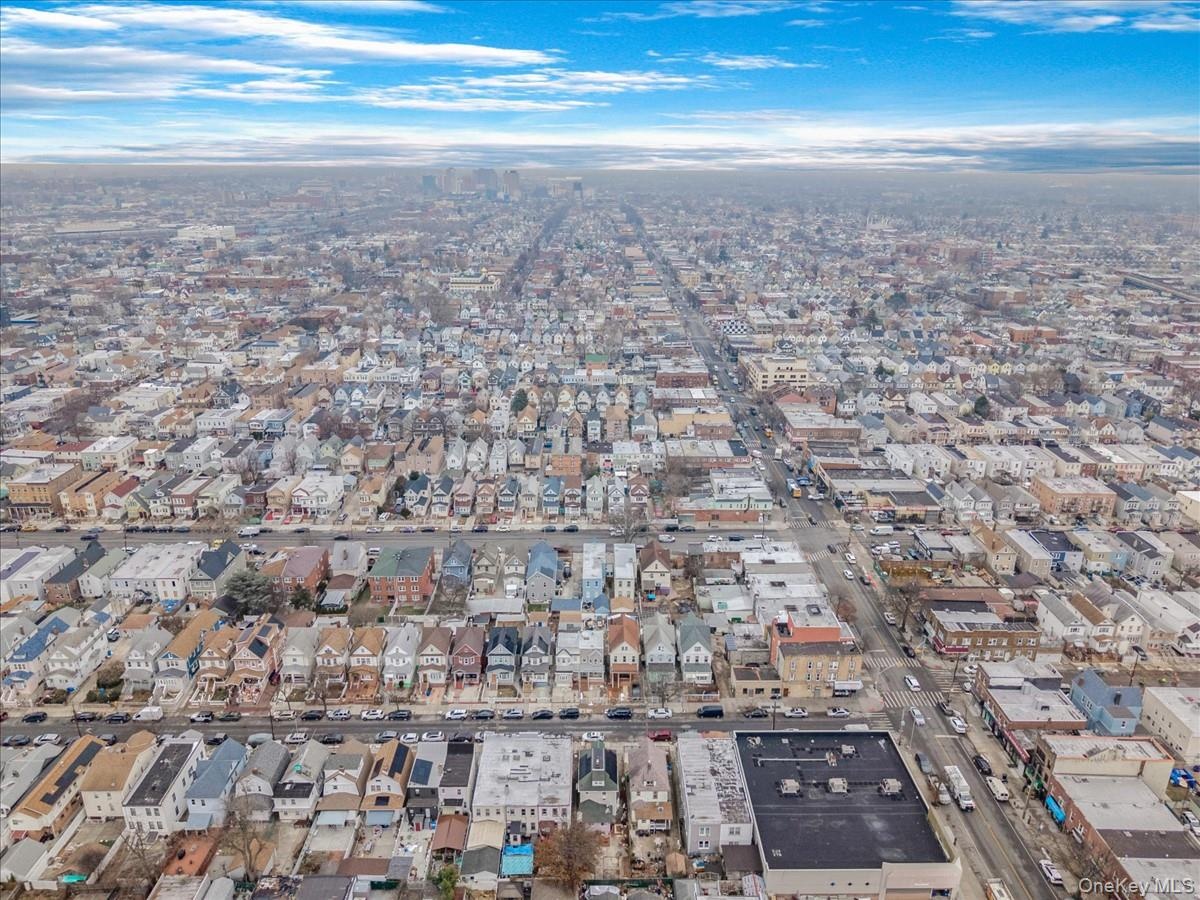 Aerial overview of property's location with nearby urban area