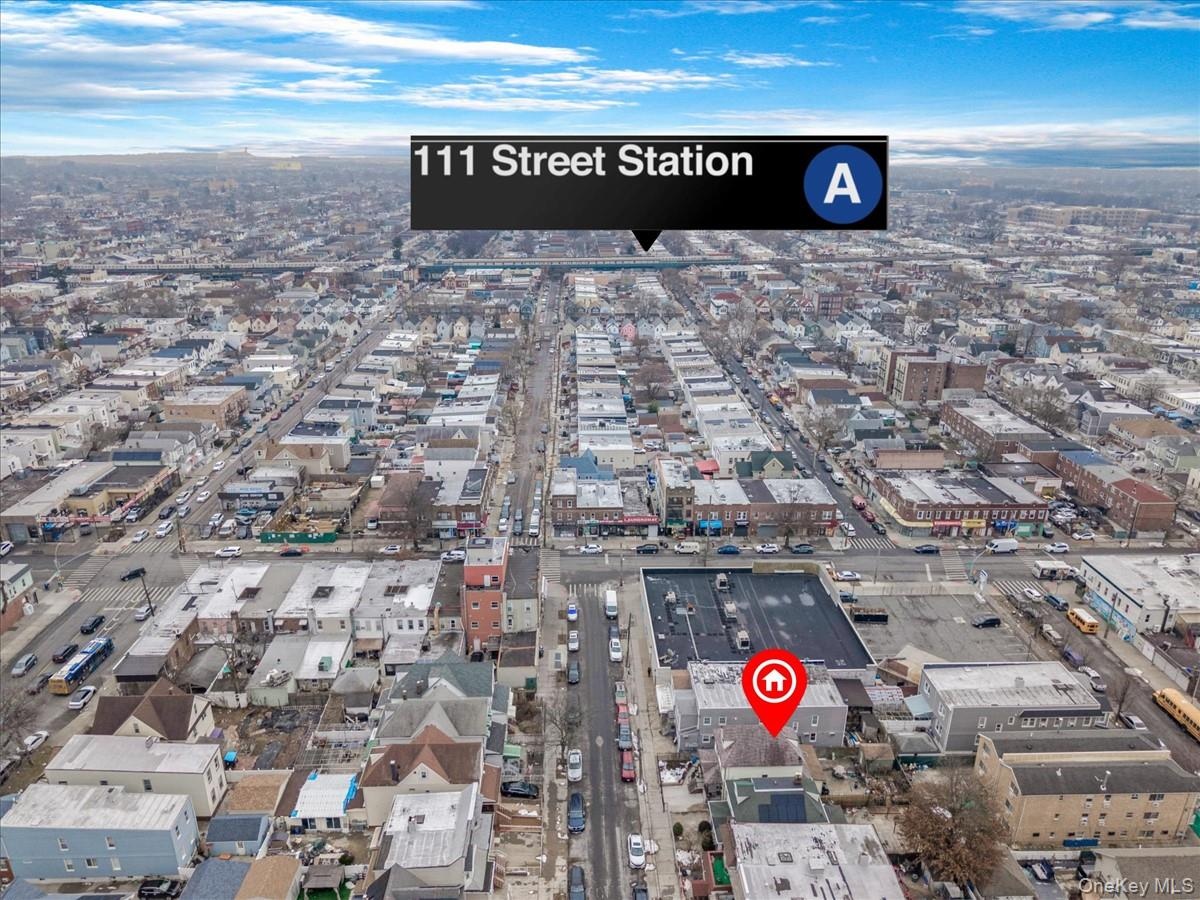Aerial view of property's location featuring nearby urban area