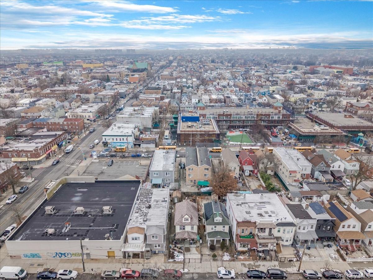 Aerial view of property's location featuring nearby urban area