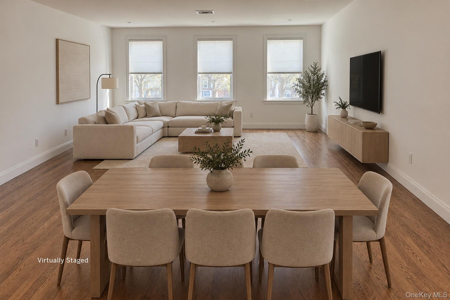 VIRTUALLY STAGED Great room from kitchen towards front window