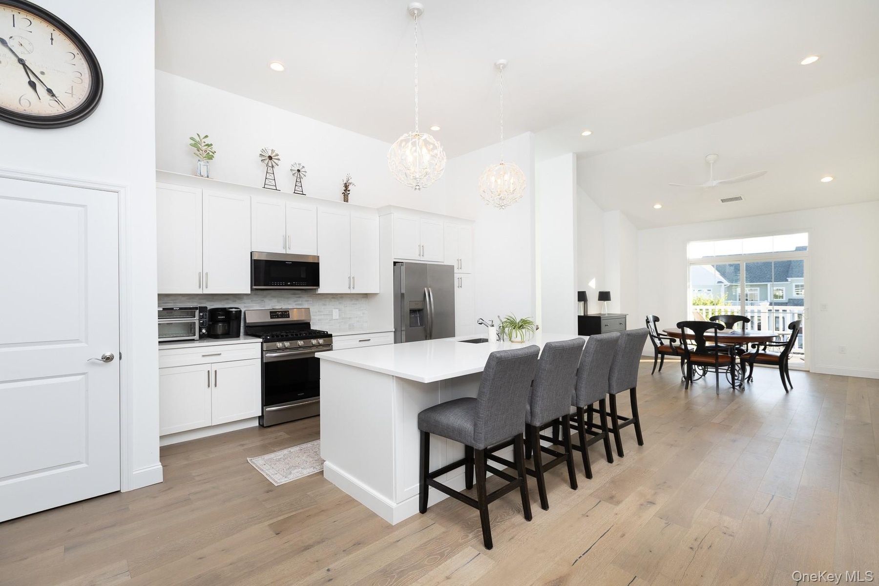 Island Kitchen Featuring Quartz Countertops and Stainless Steel Appliances