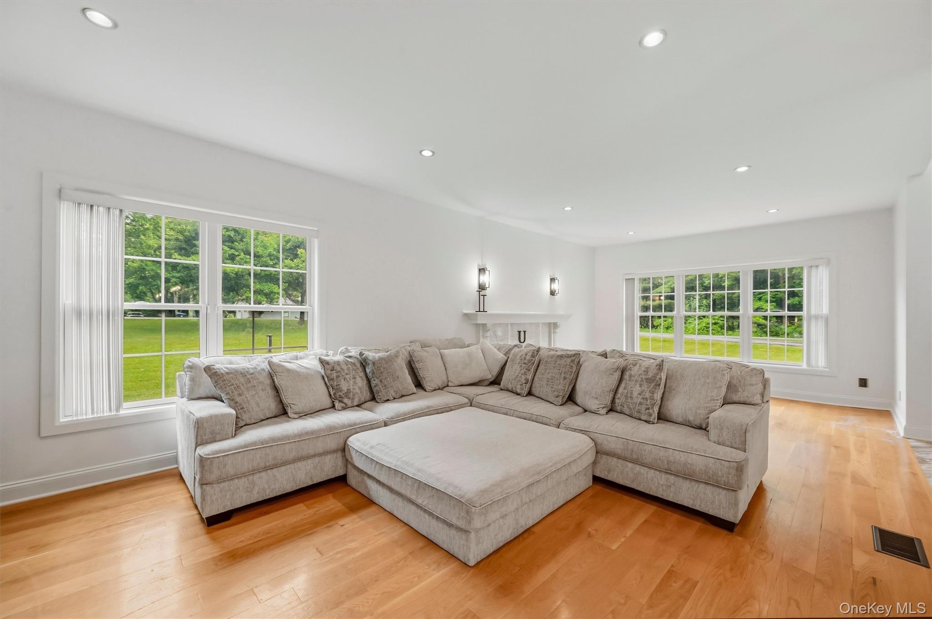 Family room, with Anderson windows, recessed lighting, wide plank white oak flooring and 9 foot ceilings.