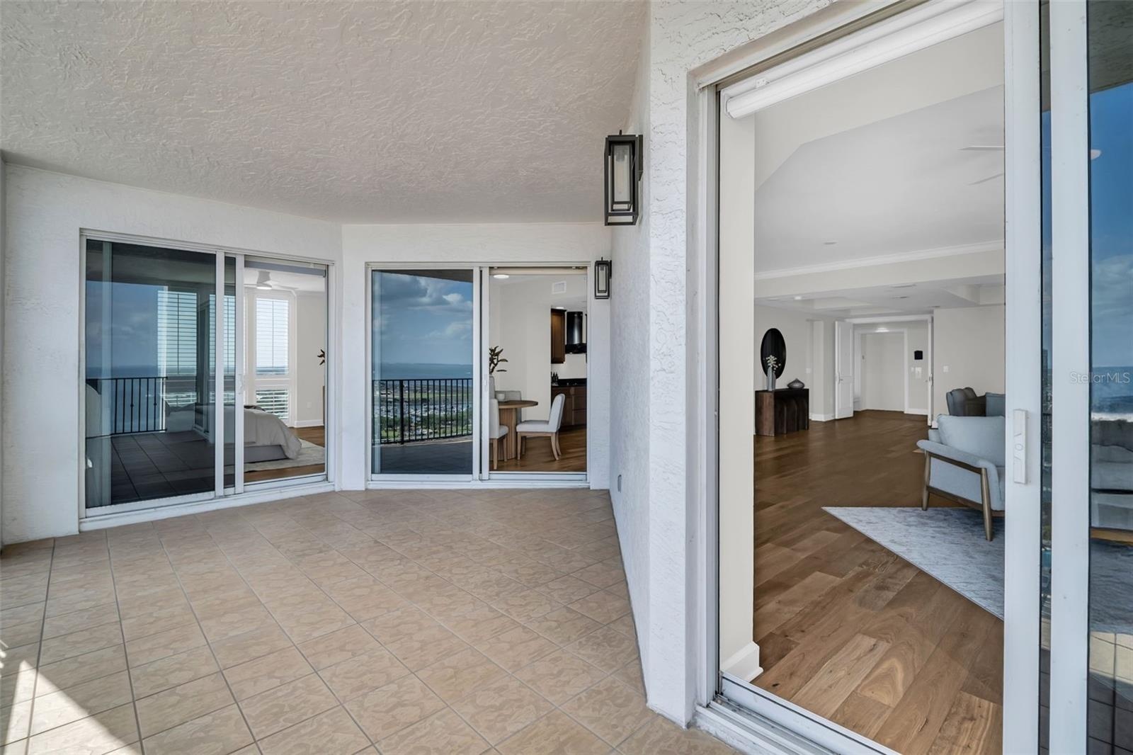 Balcony Access from Living Area,Kitchen and Primary Suite