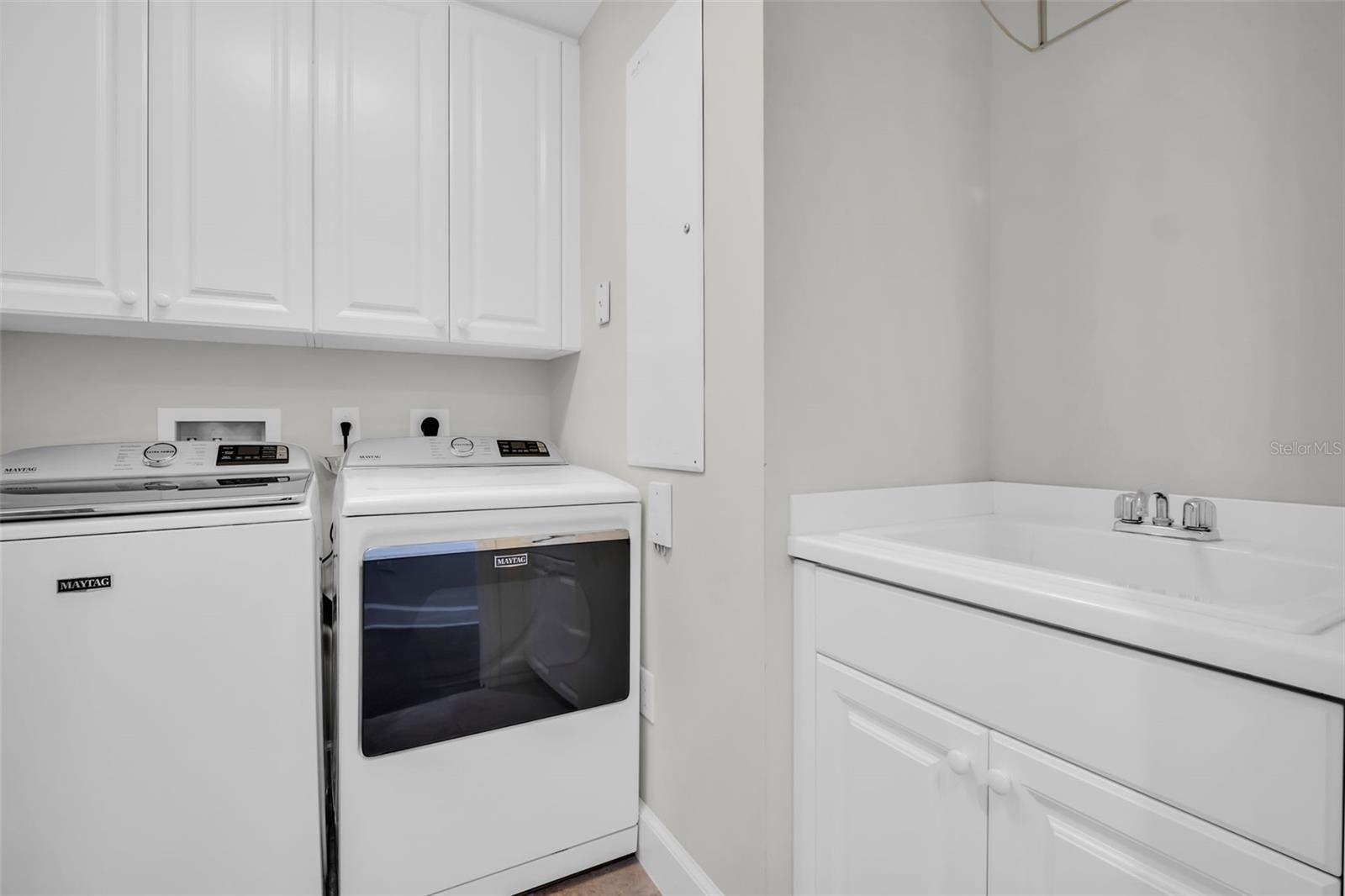 Full Size Laundry Room with Utility Sink and Storage