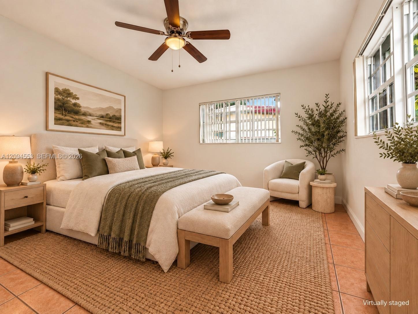Virtually staged: primary bedroom with ceiling fan and windows on two walls