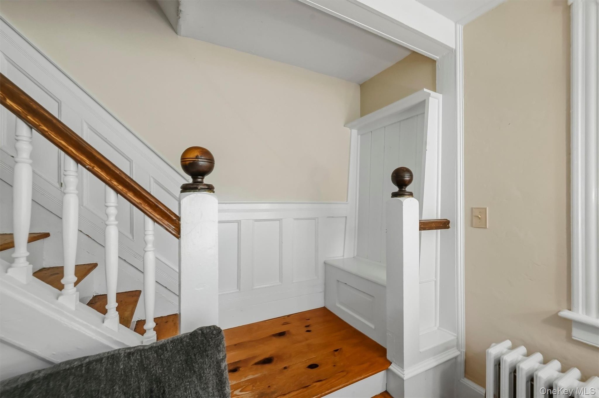 A unique pew incorporated into the staircase reflects the home’s history
