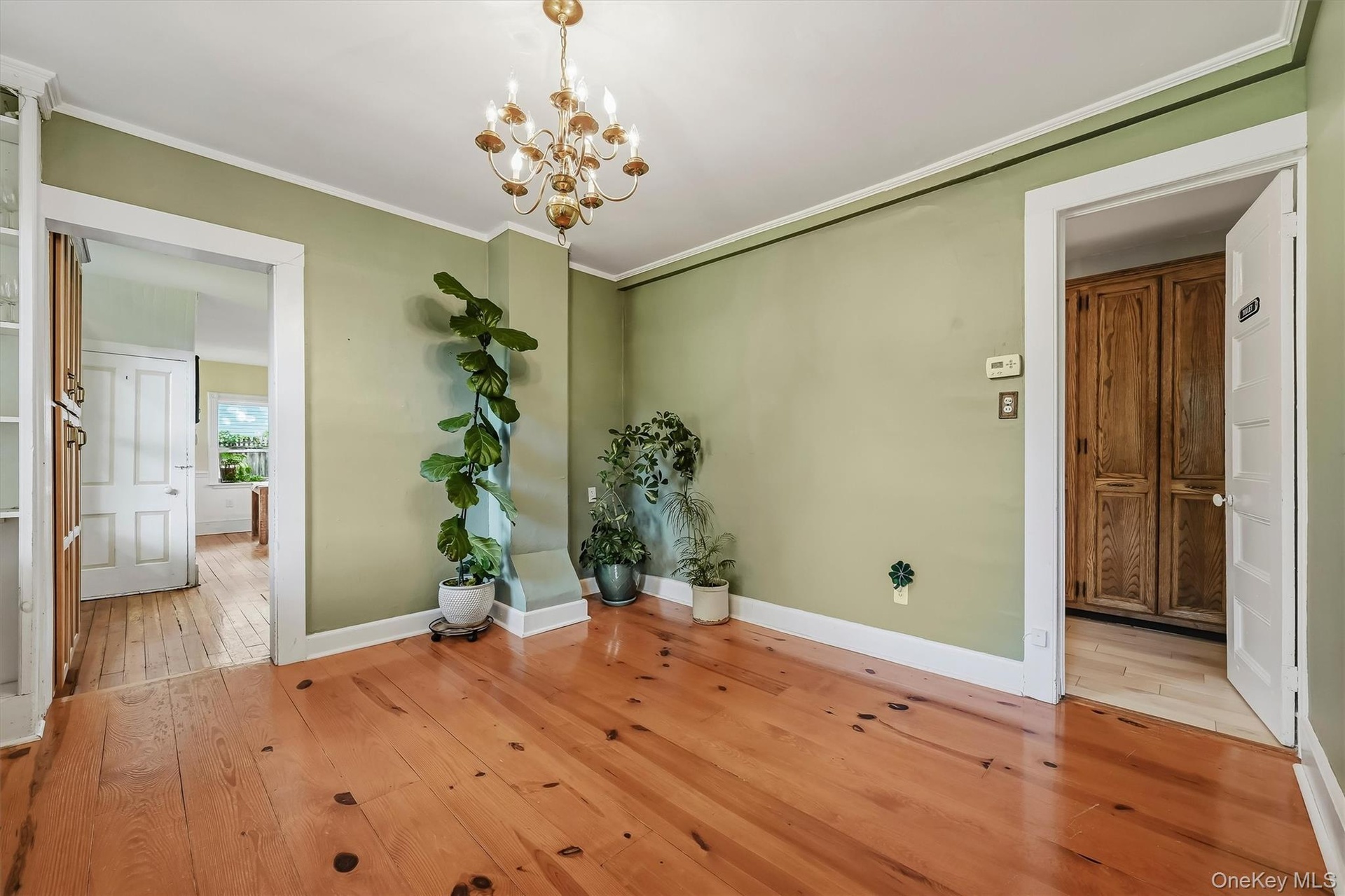 Formal dining room with hardwood floors and easy access to the kitchen