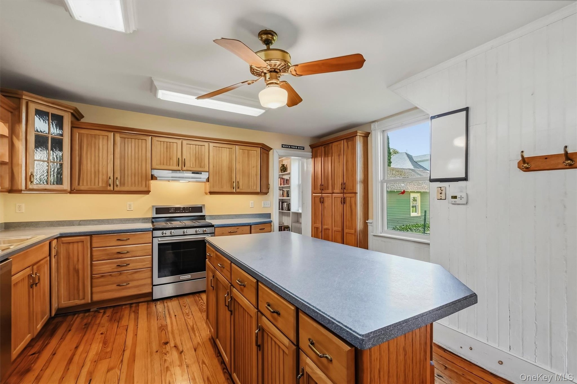 Generous kitchen offering extensive cabinetry, counter space and a large center island
