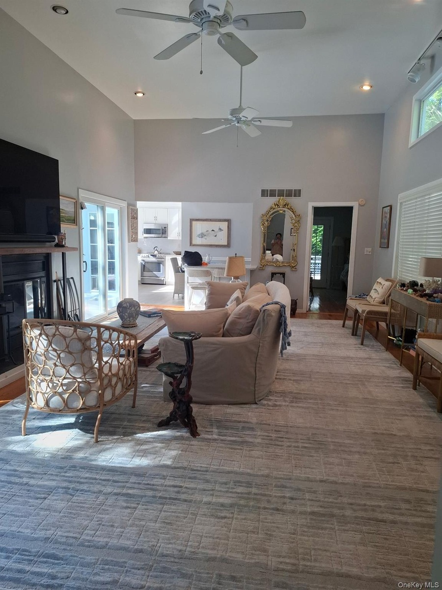 Central Living room with access to pool area and entertaining kitchen island