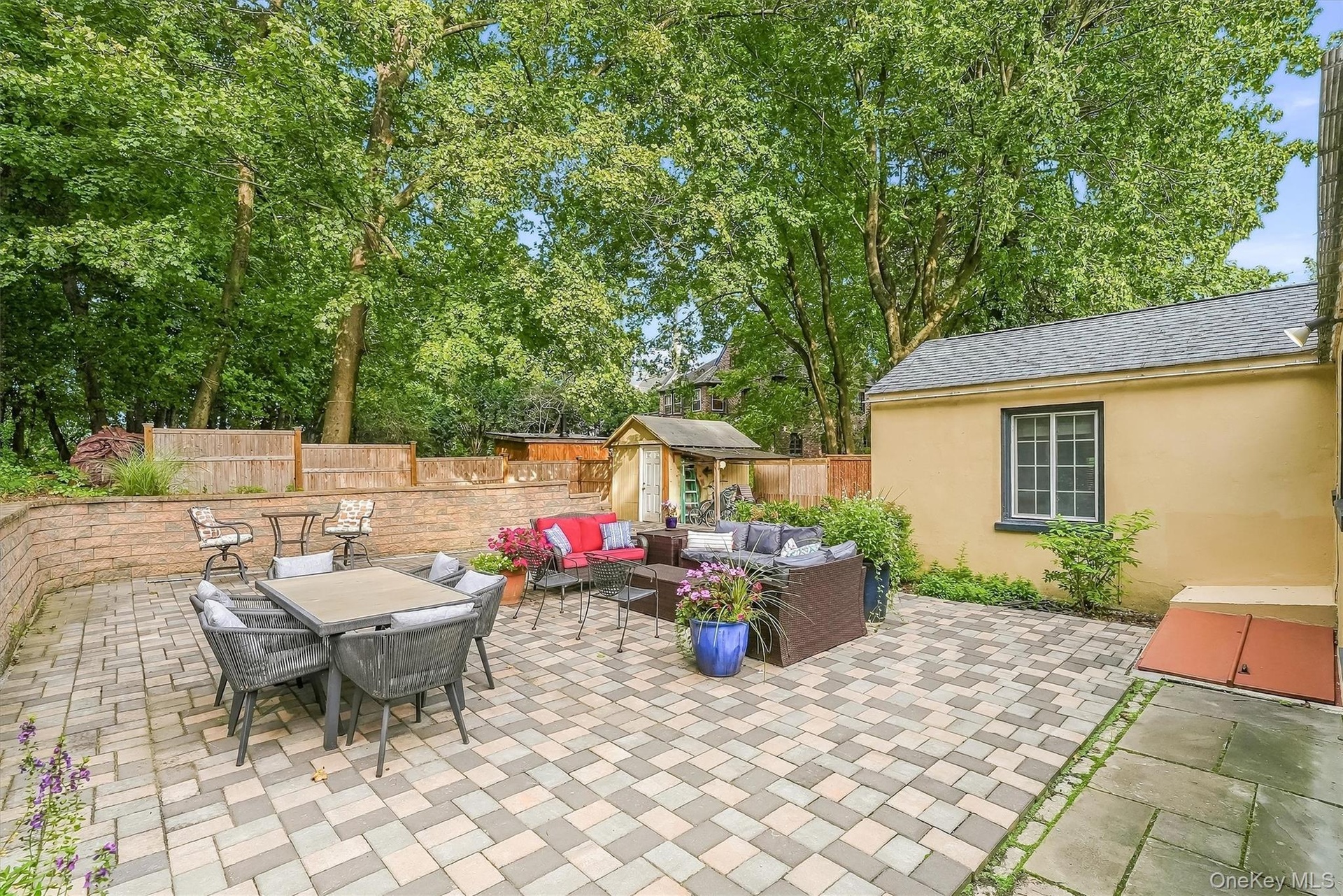 The back of the home is a custom, oversized patio offering maintenance free living.