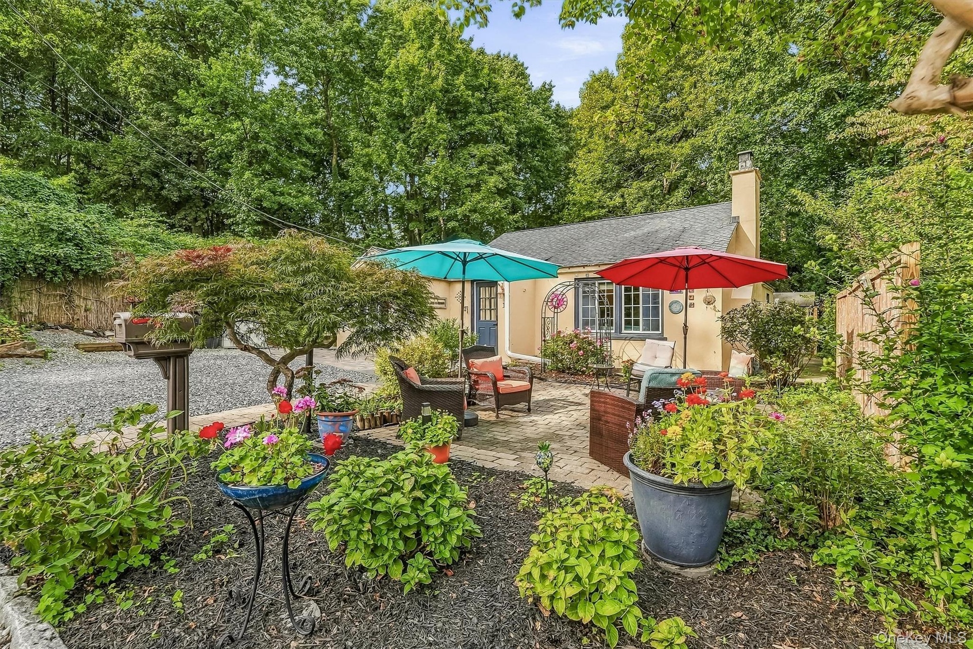 Incredible landscaping and gardens surround this charm filled home.