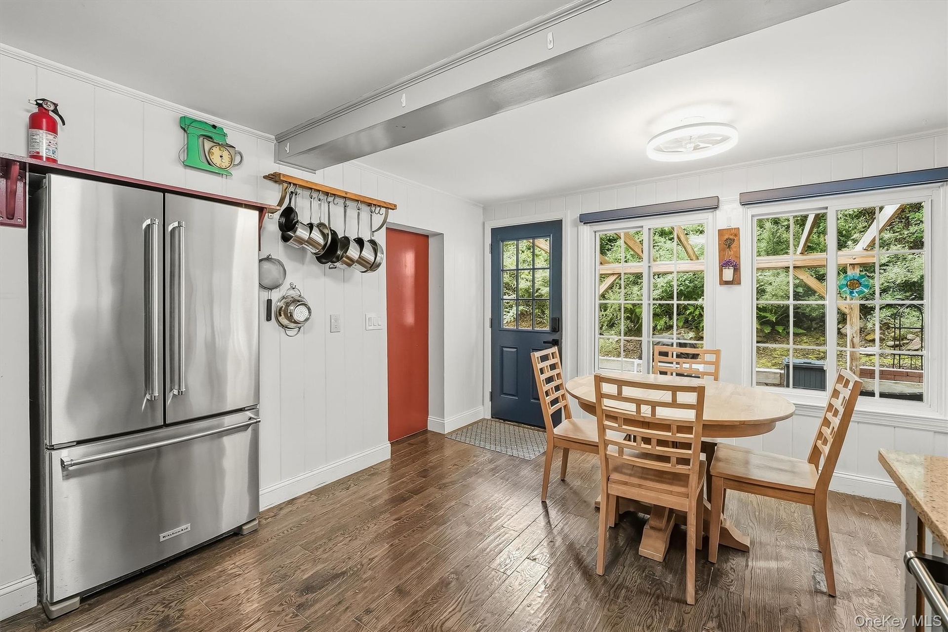 The kitchen overlooks the private backyard with a spacious custom patio.