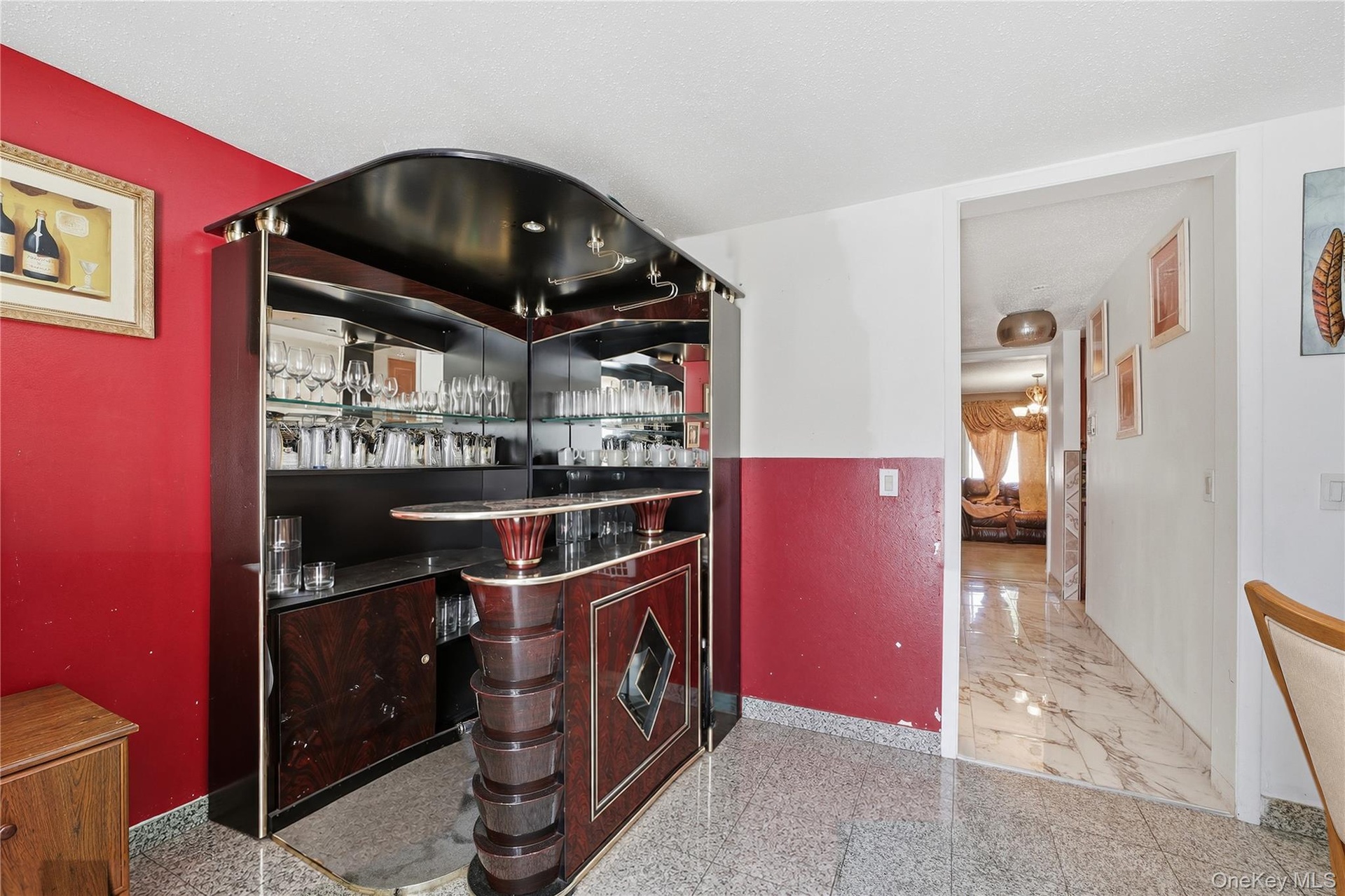 Unit 2 - Bar area looking toward the hall. Virtually staged and digitally decluttered.