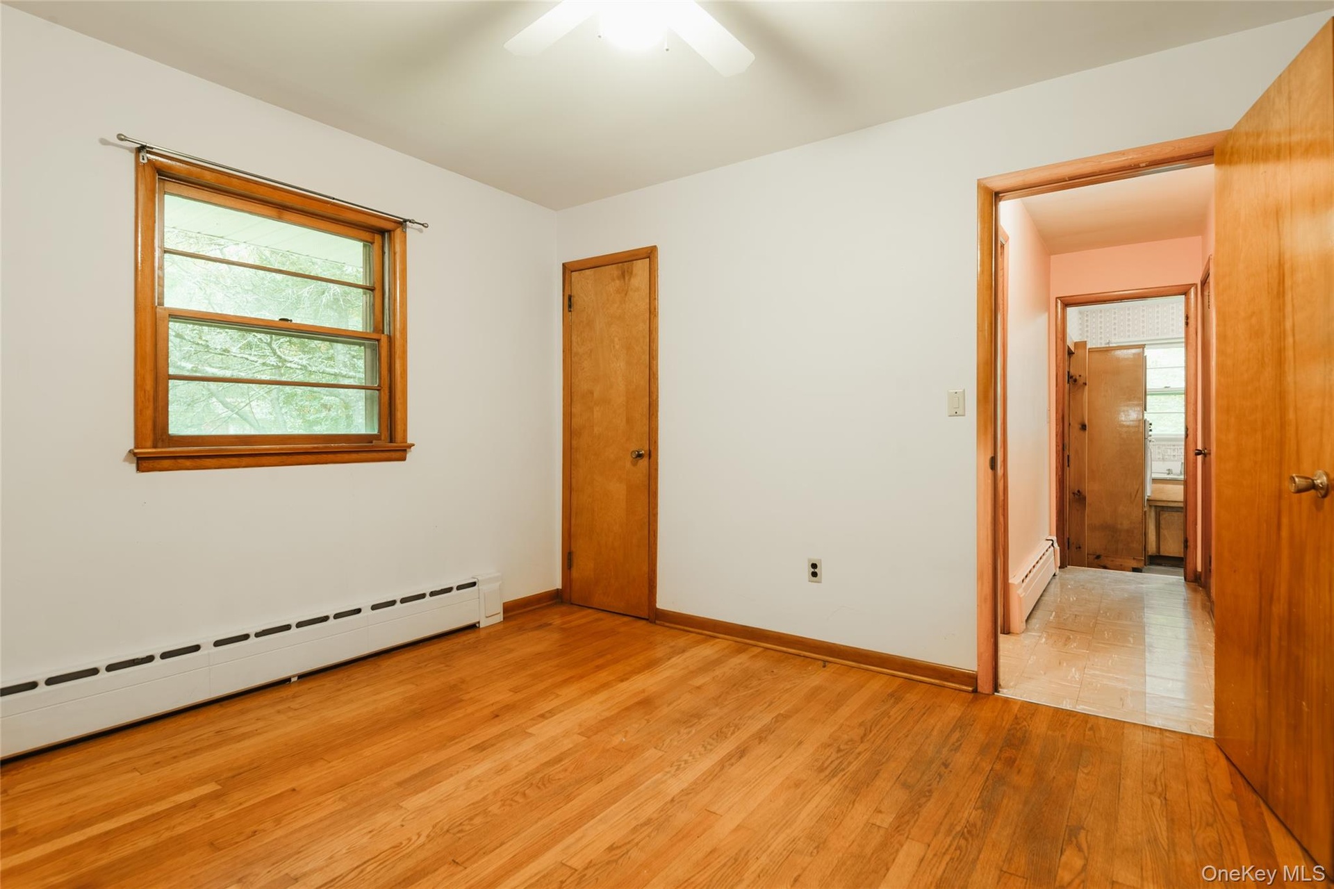 Apartment bedroom, door to main house kitchen behind