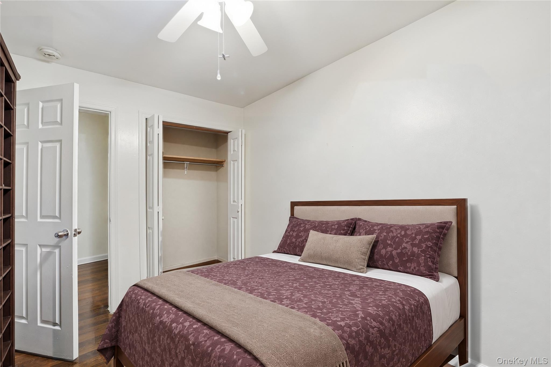 Unit 1 - Bedroom 2, closet view. Virtually staged and digitally decluttered.