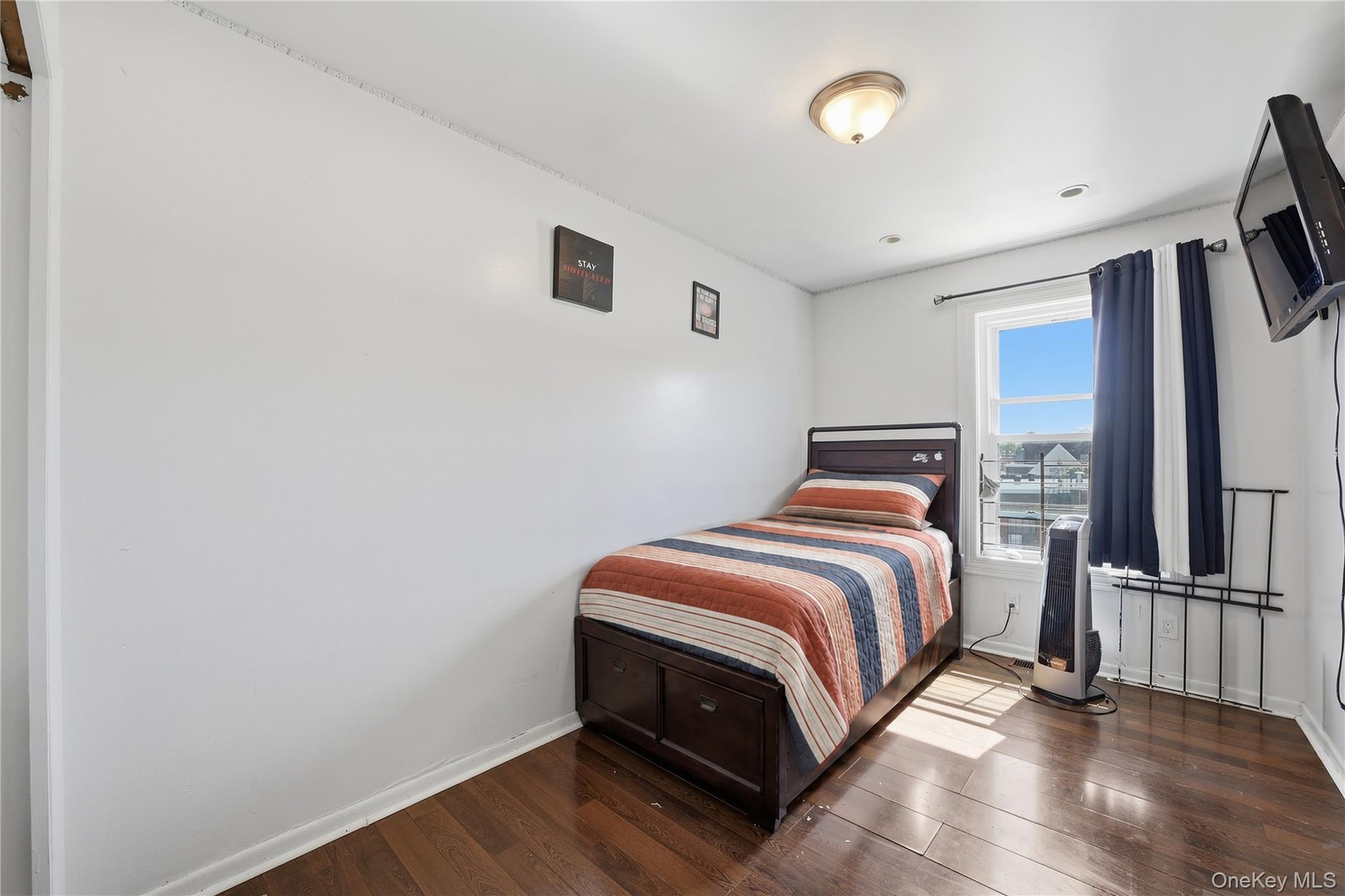 Unit 2 - Bedroom 3. Digitally decluttered; bedding and decor restyled.