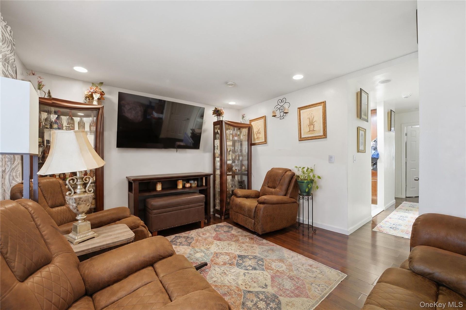 Unit 1 - Separate apartment living room, reverse view. Digitally decluttered; some decor restyled.