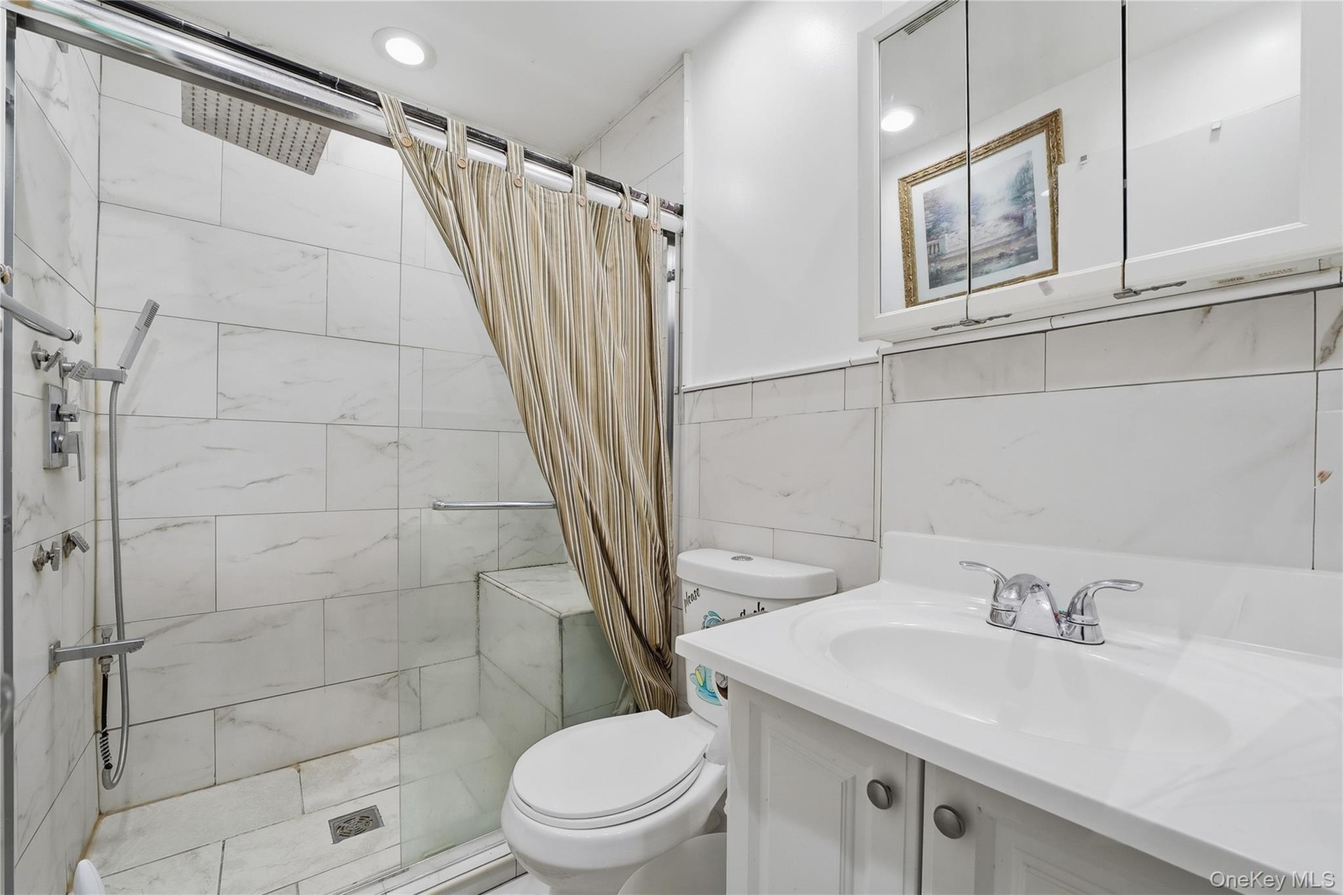 Unit 2 - Bathroom with walk-in shower. Digitally decluttered.