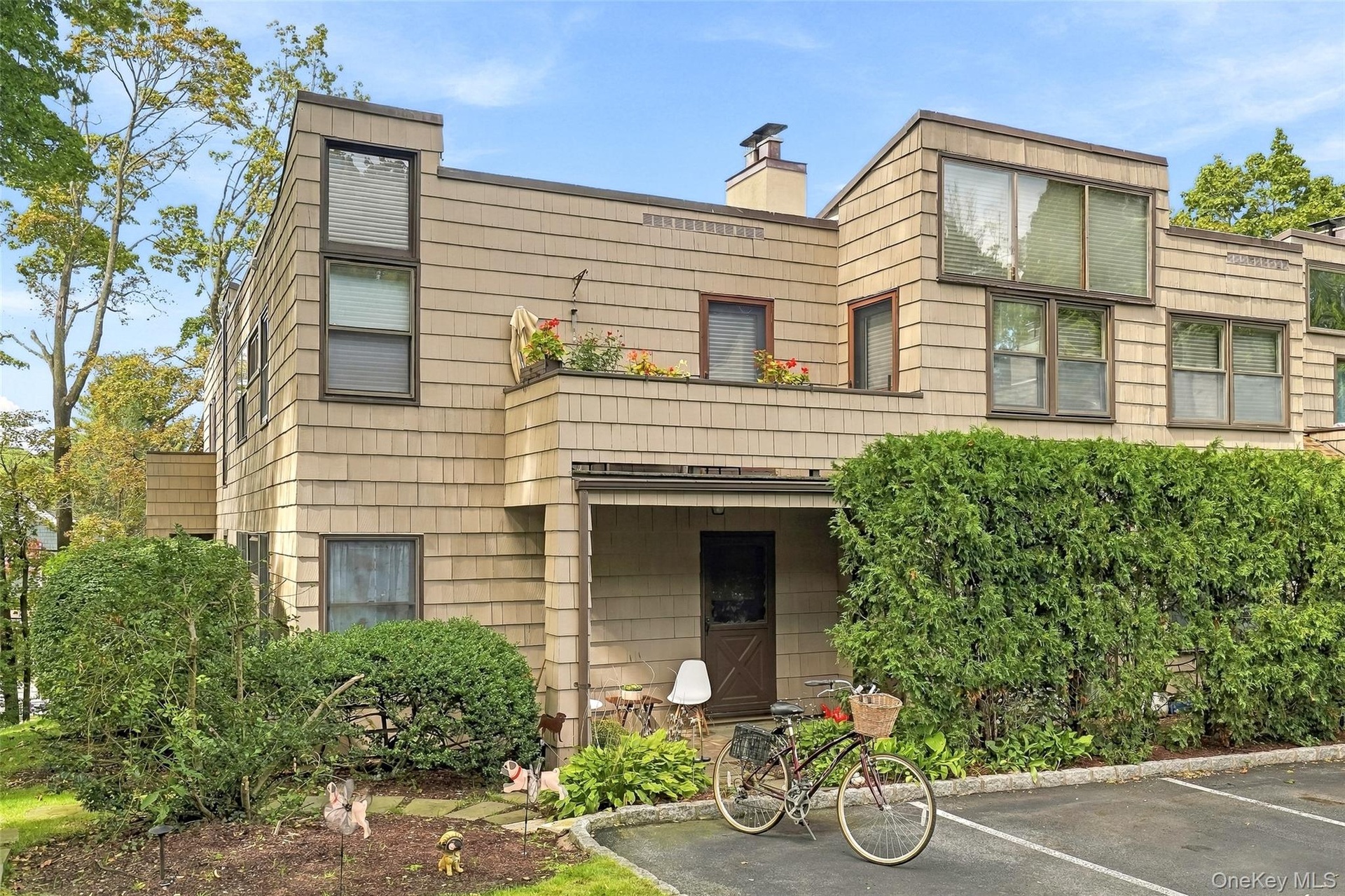 Convenient entry and exit into your one level home on the corner with a designated parking space immediately outside your private entrance.