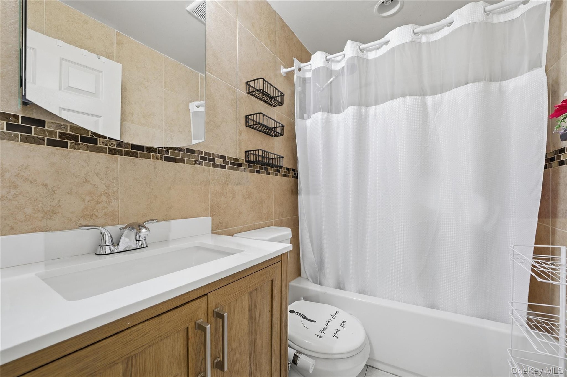 Unit 1 - Bathroom with bathtub. Digitally decluttered.