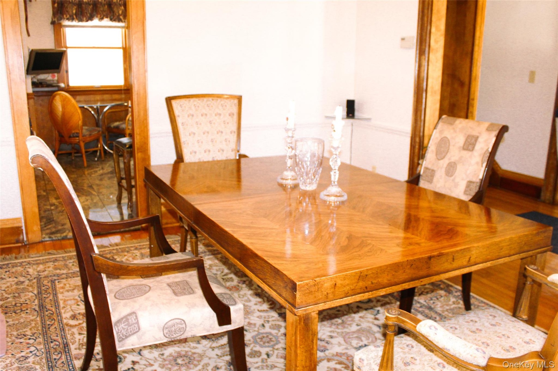 Formal Dining Room with Hardwood flooring, and wood trim accents
