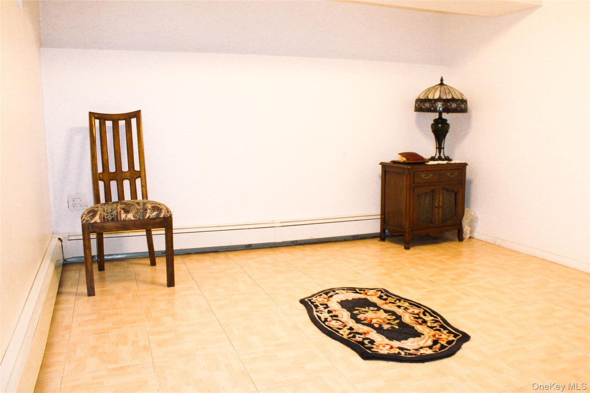 Recessed lighting illuminating a spacious room with   hard-surface flooring and closet