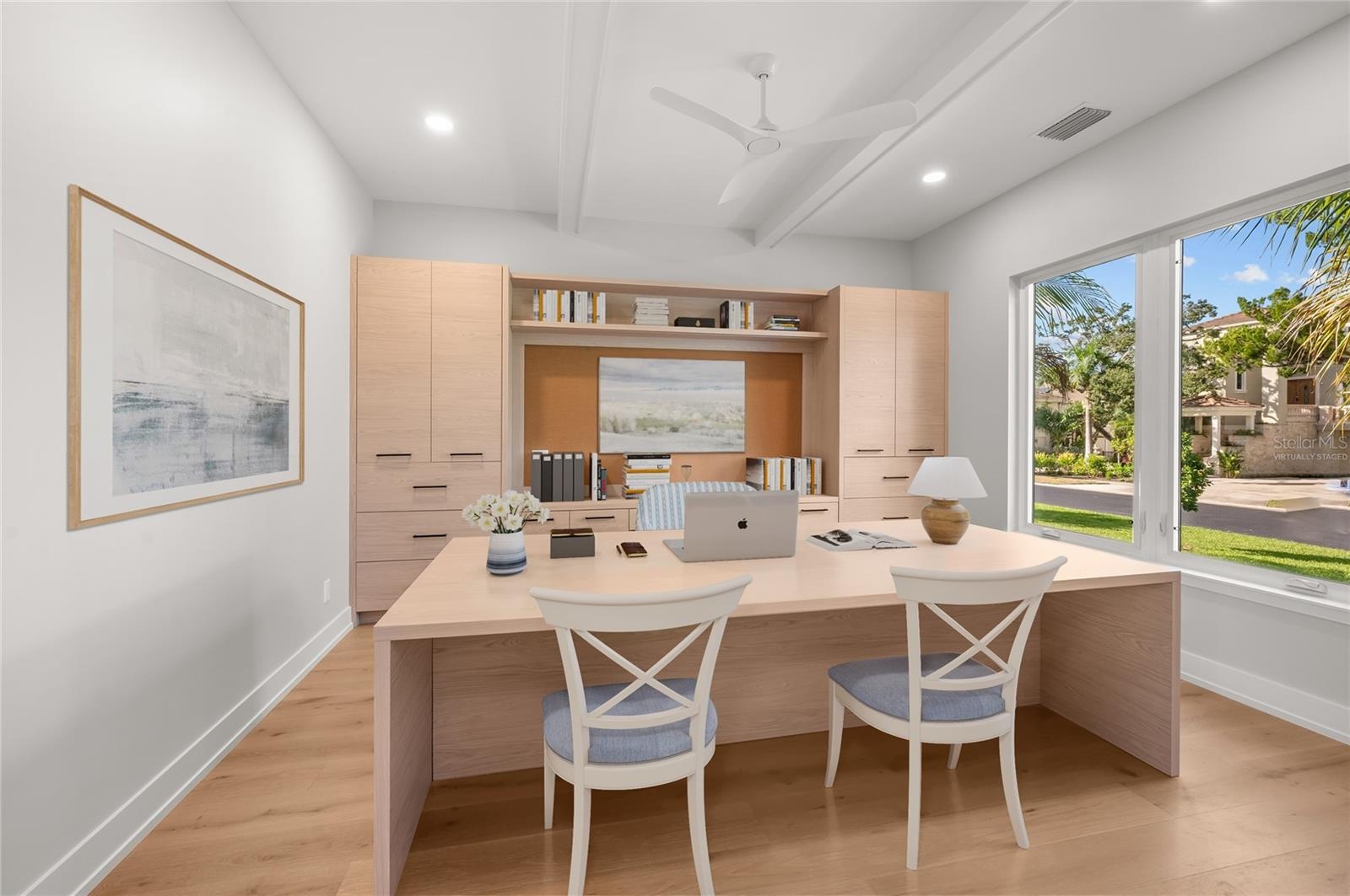 Virtually staged, first floor built in office.