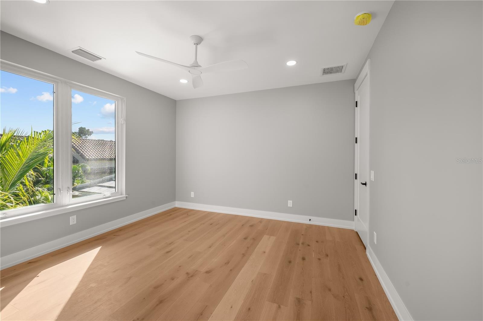 Second floor -5th bedroom overlooks the back yard with walk in closet and full designer bathroom.