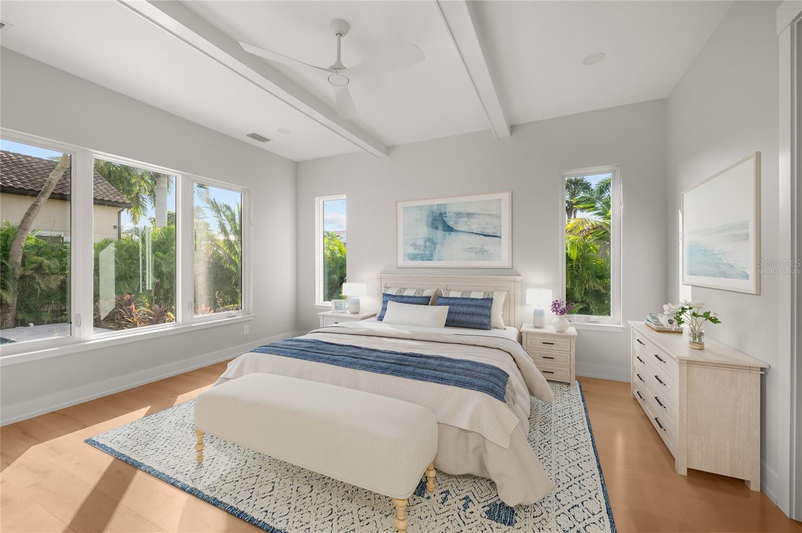 Virtually staged primary suite featuring elevated custom trim and refined architectural detailing.