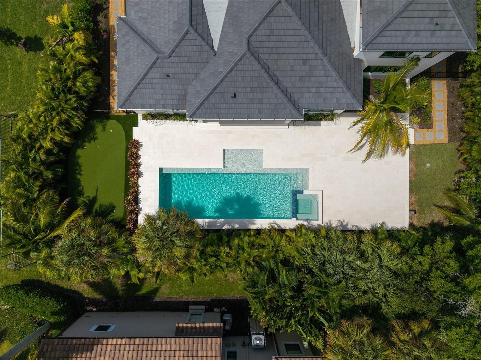 Back yard is the perfect place to entertain and even offers a putting green!