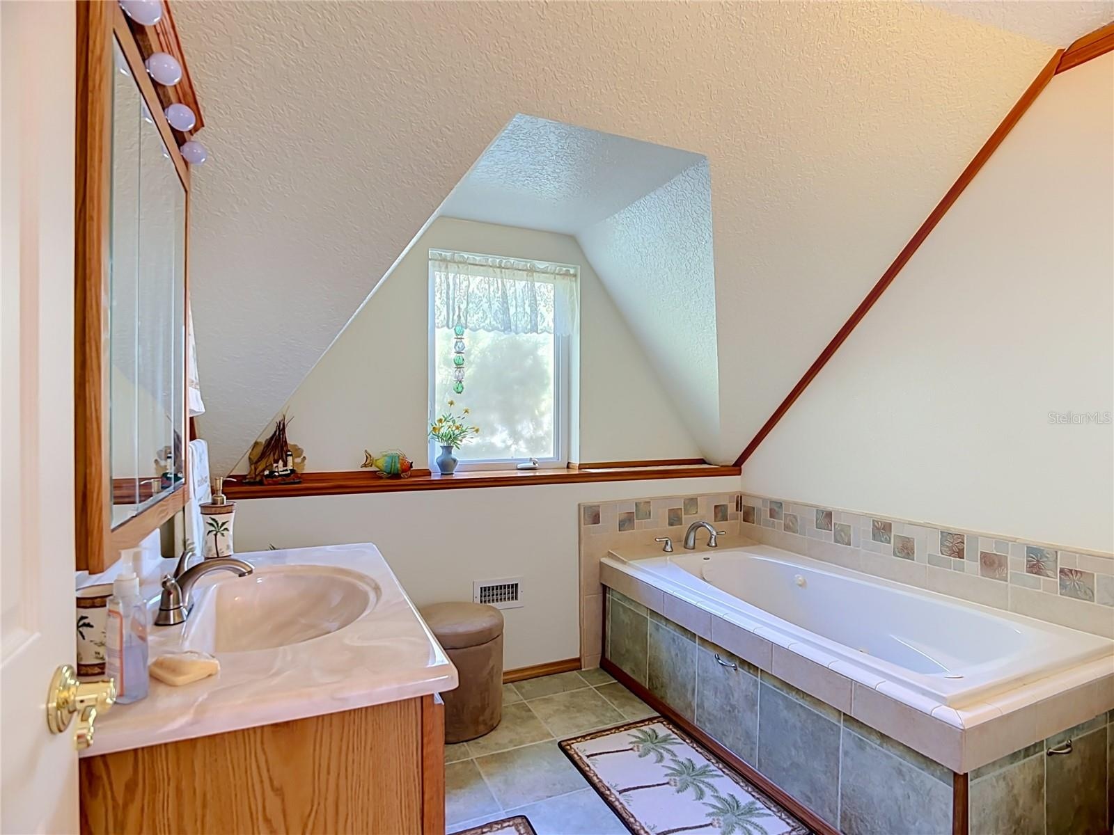 Second bathroom upstairs with jetted tub.
