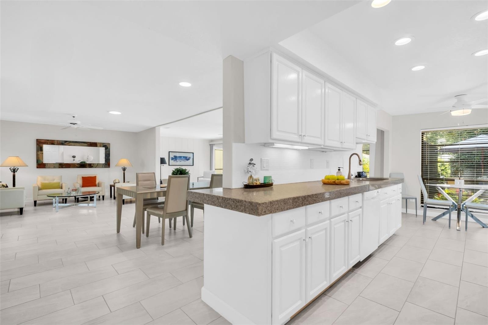 Beautiful kitchen with granite countertops, freshly painted solid wood cabinets, and recessed lighting~