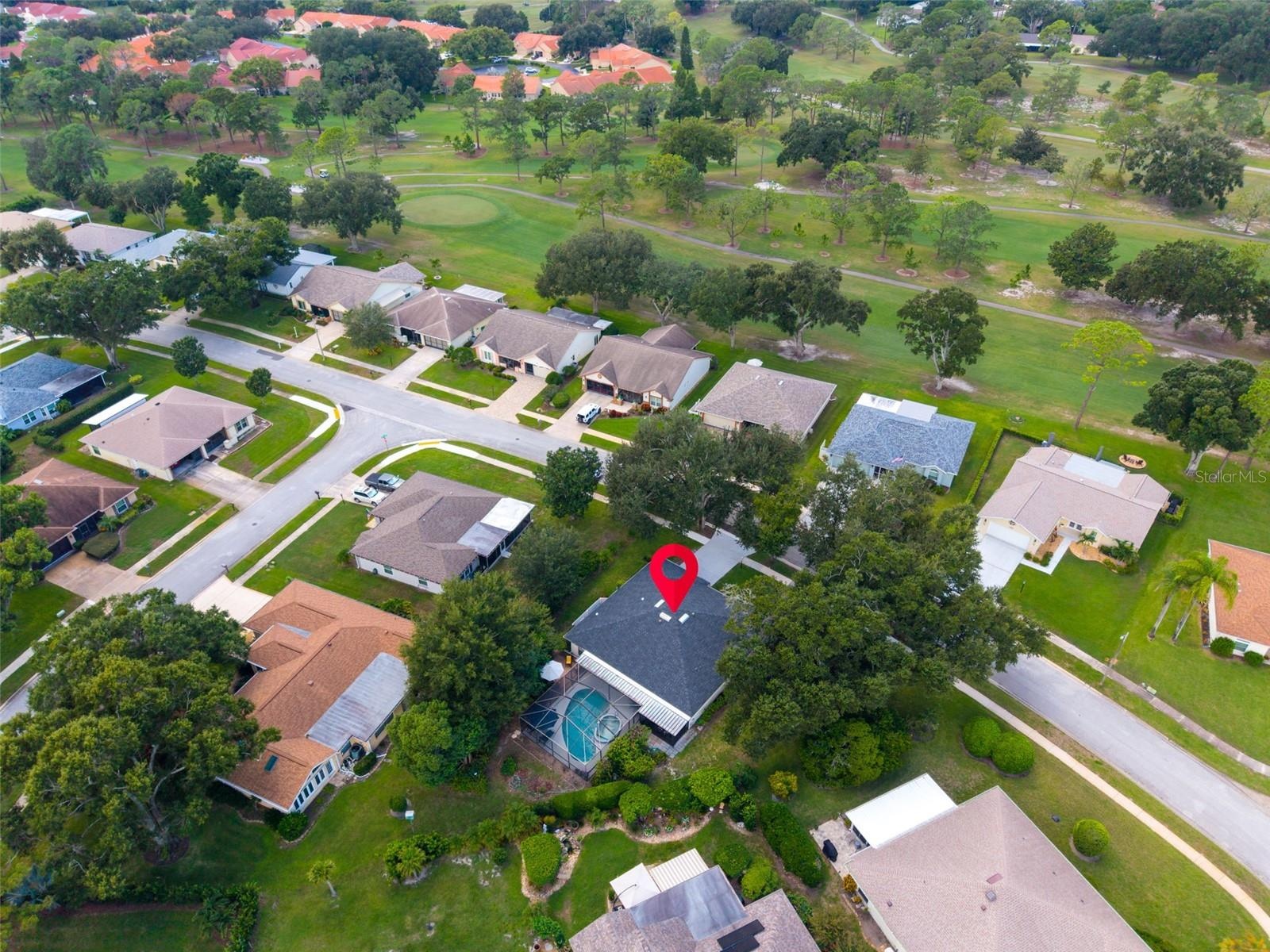 Perfectly across from the golf course on one of the most desirable streets in Highland Lakes~