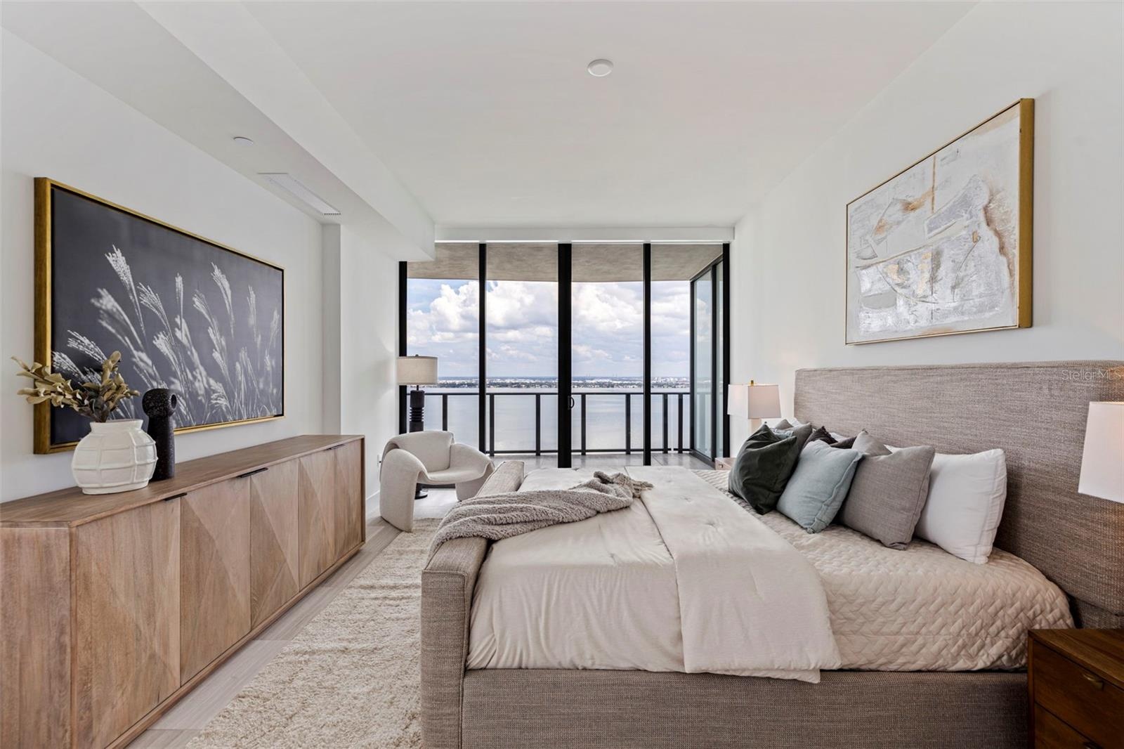 Begin each morning wrapped in light, with sweeping water views framed by floor-to-ceiling glass.
