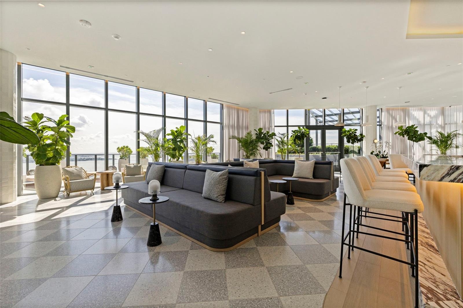 Walls of glass and relaxed seating make this a true extension of home.