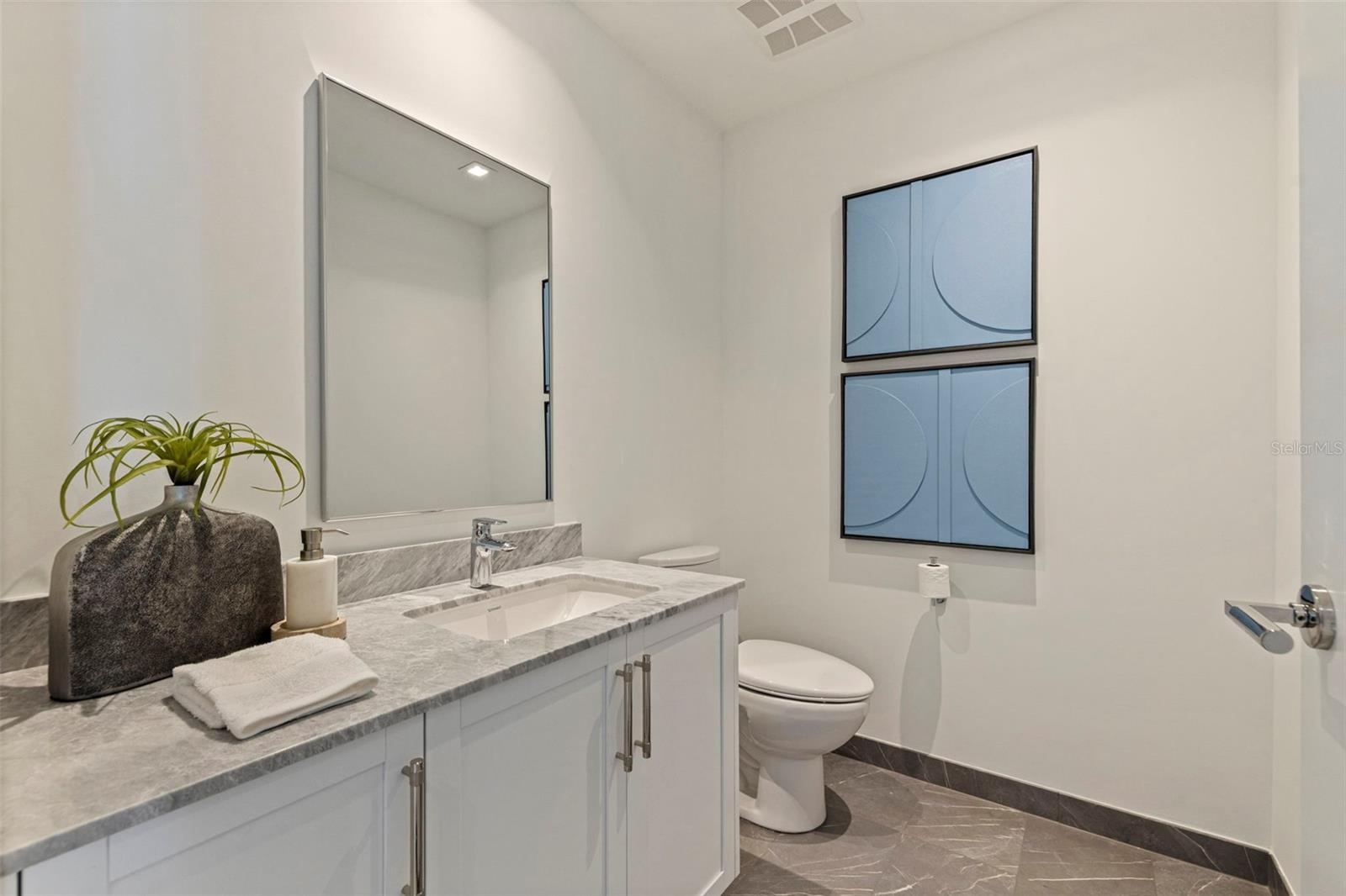 A polished powder bath adds a refined touch for guests.
