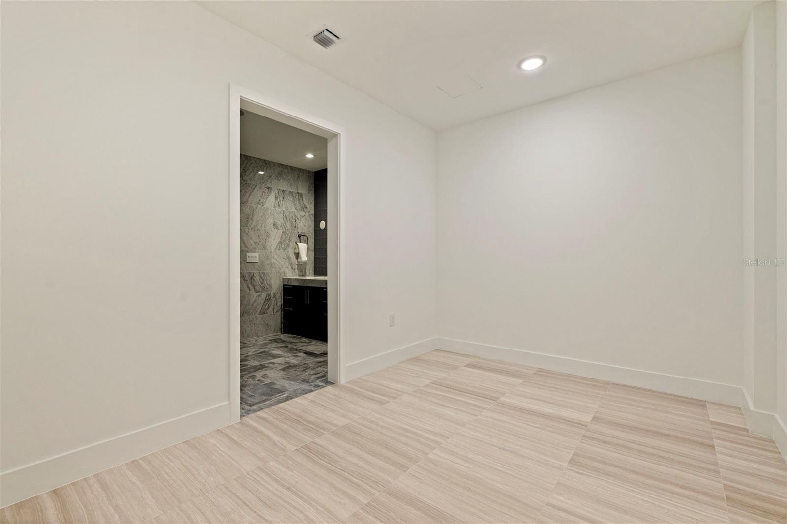 An expansive primary walk-in closet awaiting customization,