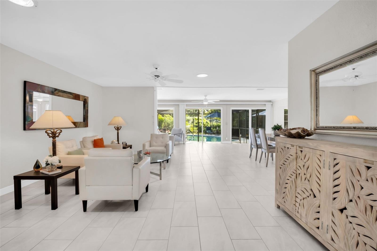 Light & bright upon entry with direct pool views~
