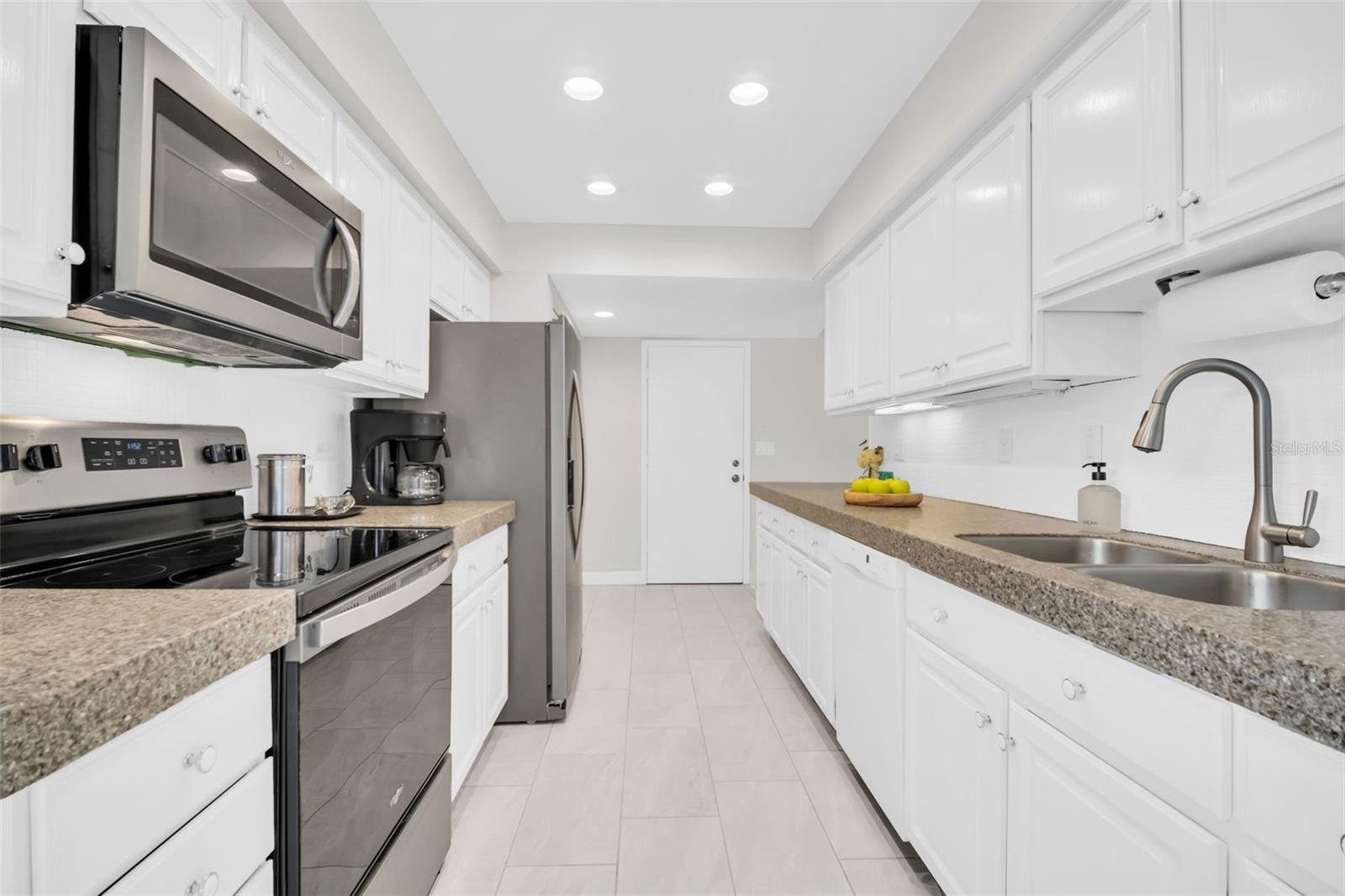Abundant cabinets for storage & countertops making food prep a breeze~