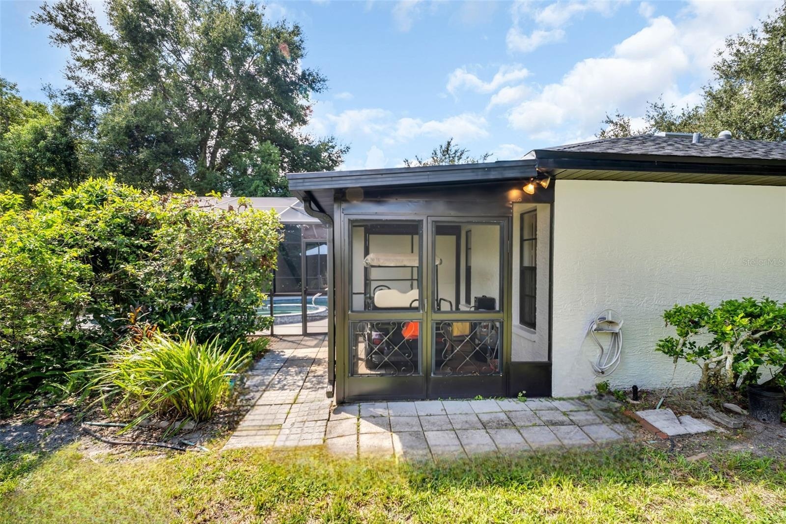 Convenient golf cart garage off the rear of the home~