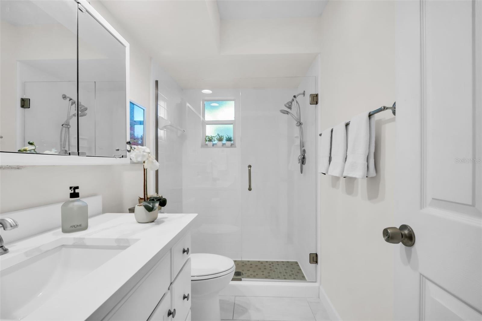Beautiful en-suite renovation with a glass enclosed walk-in shower~