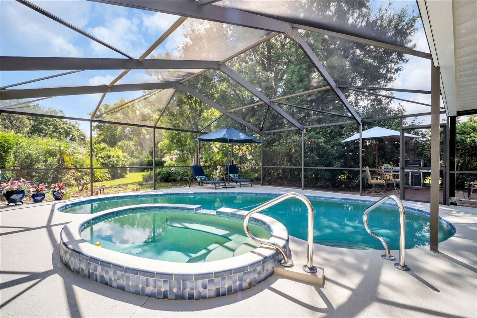 Newly landscaped around the screen enclosure for green views & privacy~