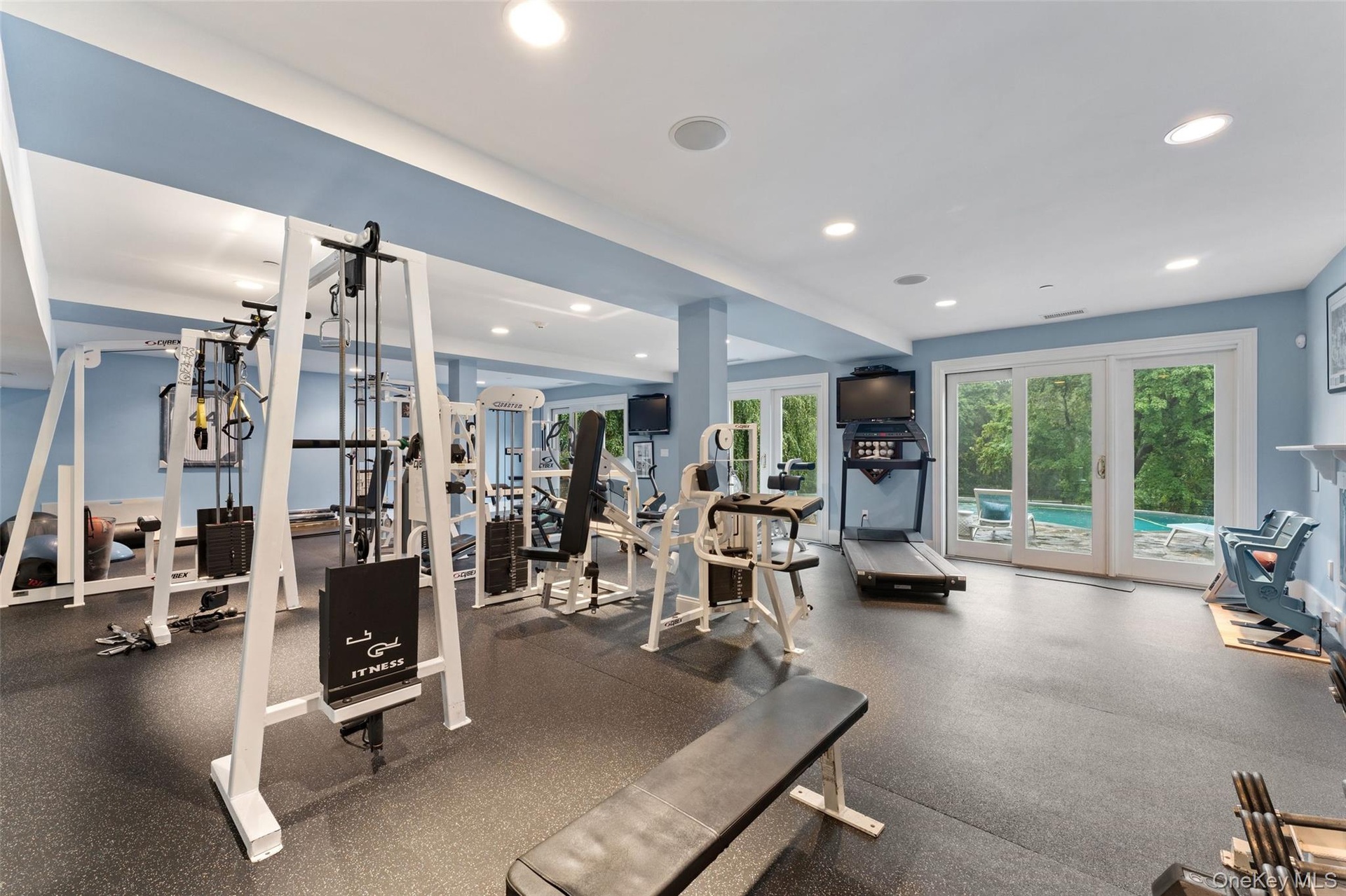 Gym with walkout access to pool