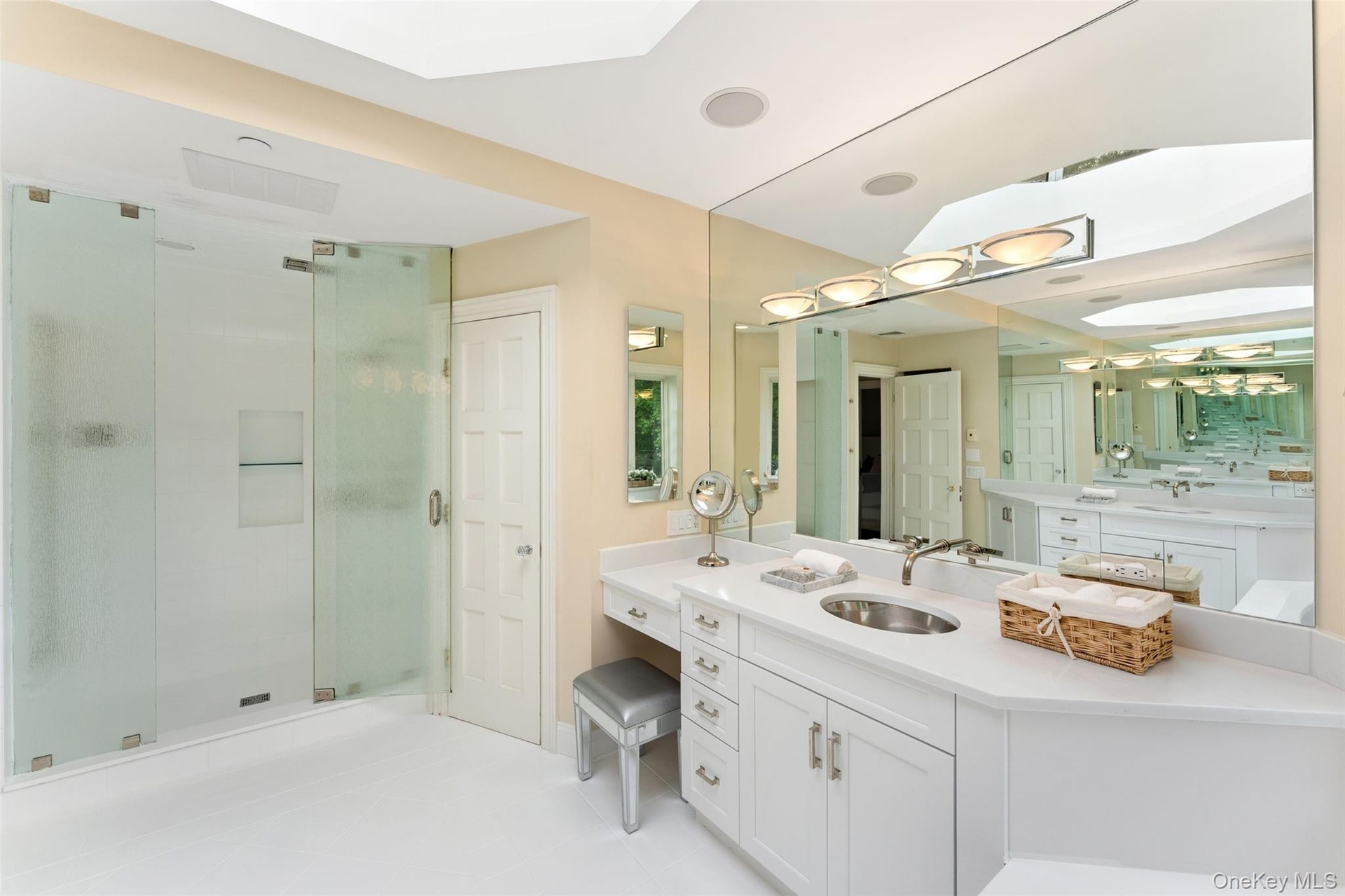 Primary bathroom with large shower and skylight
