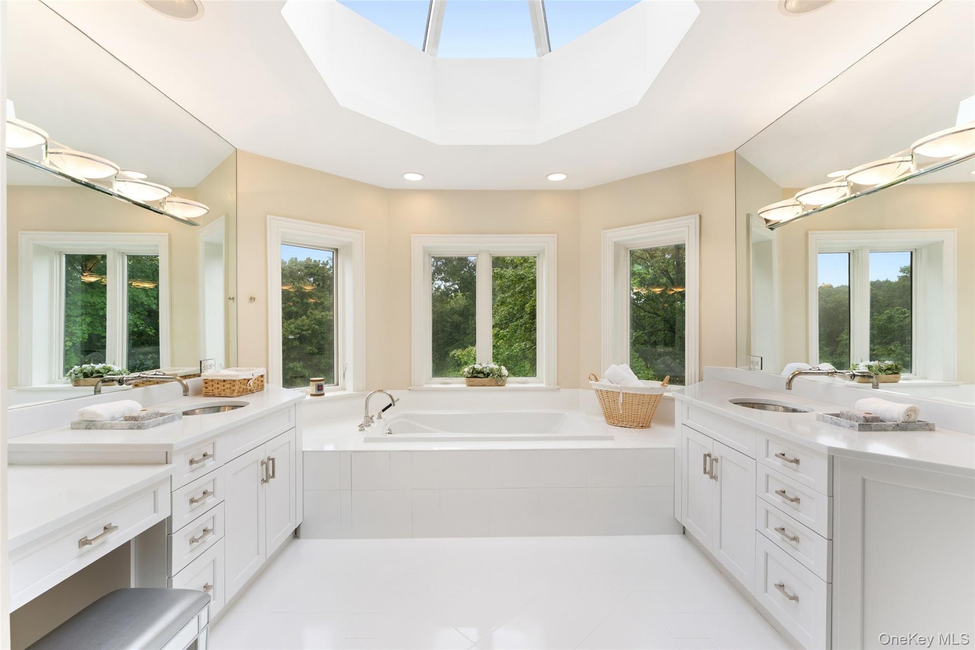 Primary bathroom with 2 vanities and soaking tub