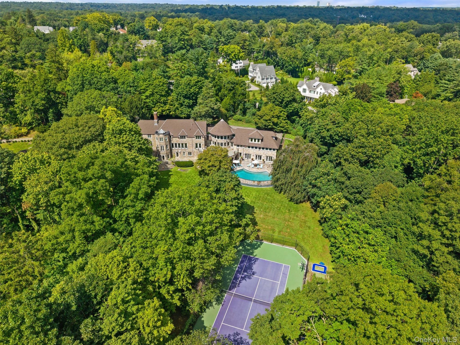 Set on 3 acres, this Sterling Ridge rennovated estate boasts a tennis court and pool
