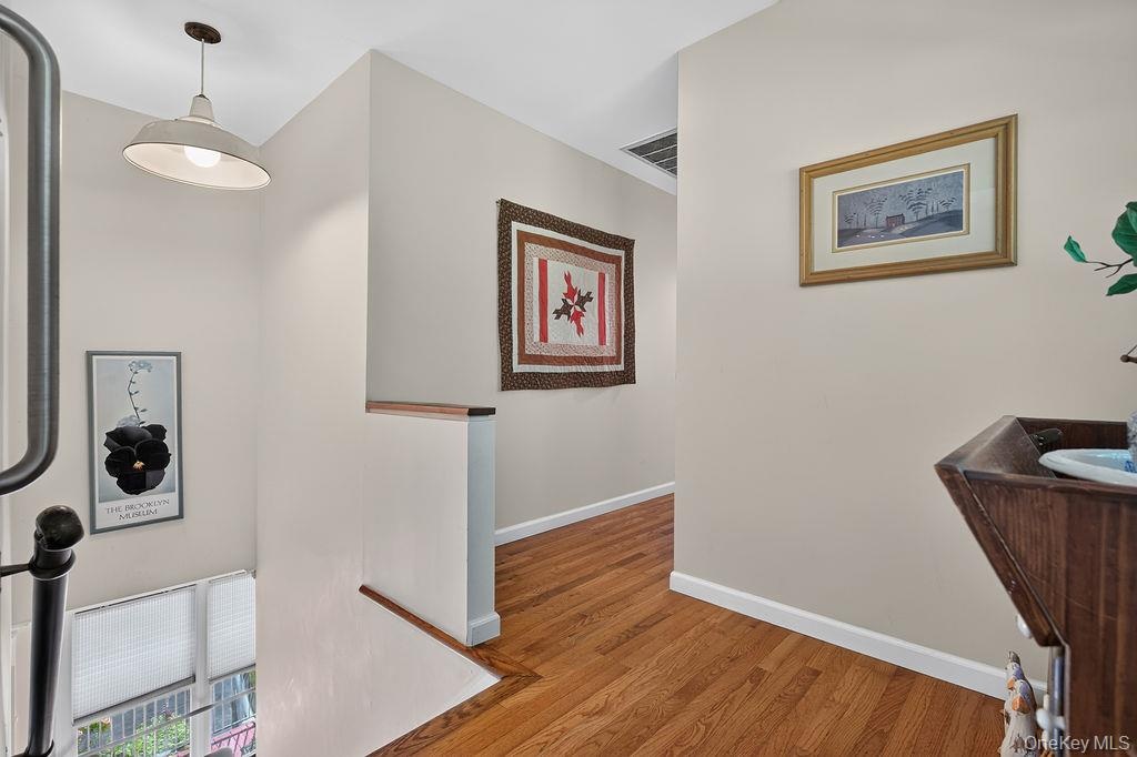 Sunlit second story hallway. Stair Chair Lift removed for photo