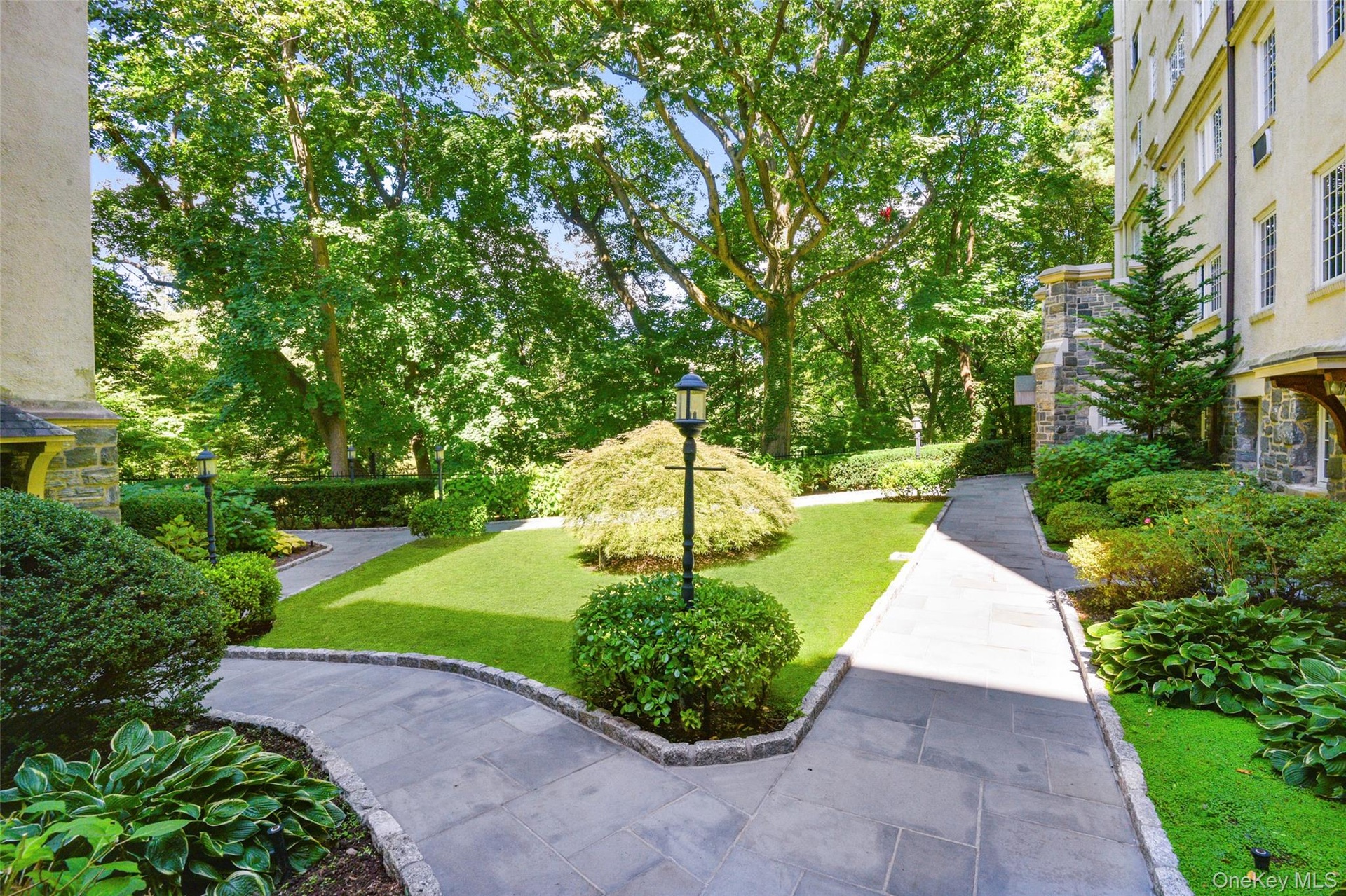 View of home's community with a lawn